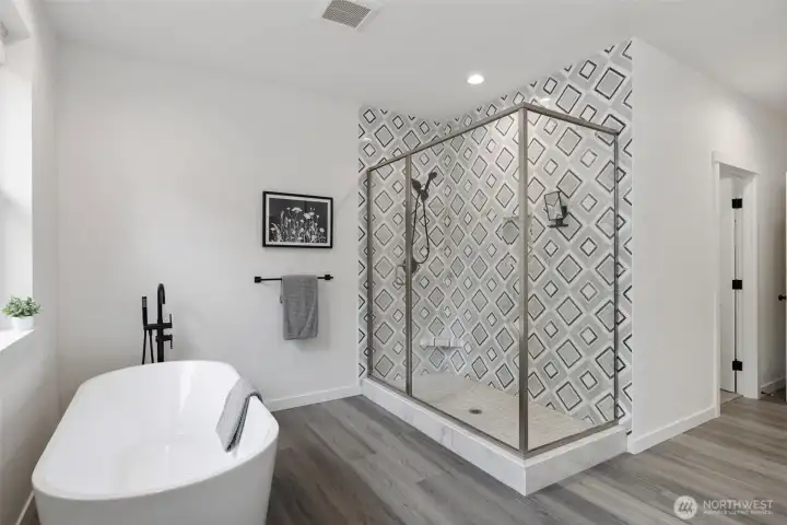 Primary ensuite bath glass shower and stand alone tub