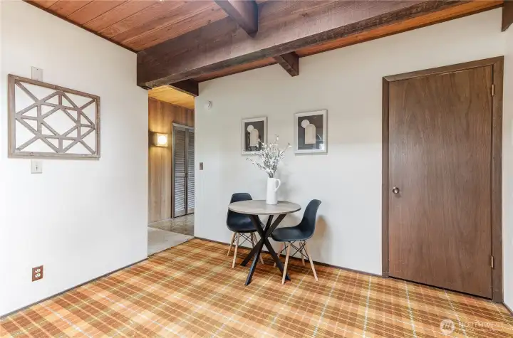 The eating area in the kitchen. The door is to a large pantry.