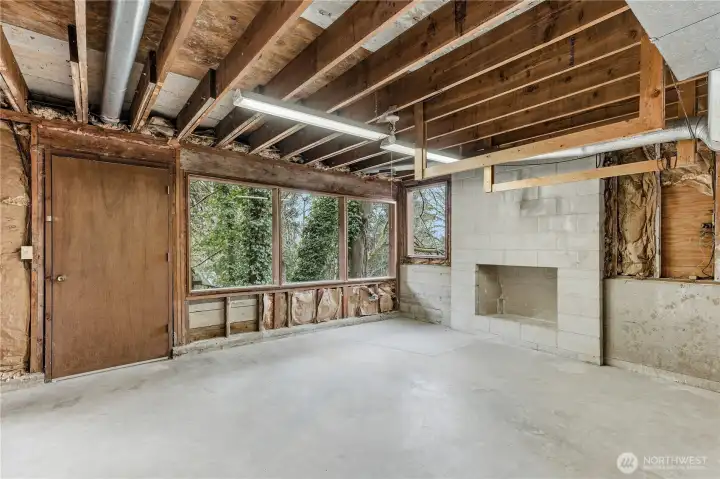 The unfinished basement with a fireplace provides ample opportunity for expansion.