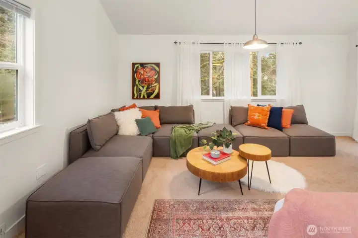 So much space in this primary suite that you can easily have a full sized lounger sofa.