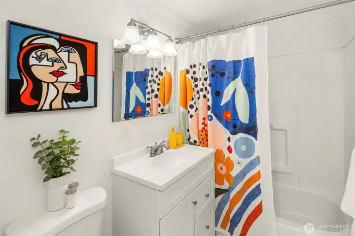 There is a full bathroom that lives in the hallway on the main level.