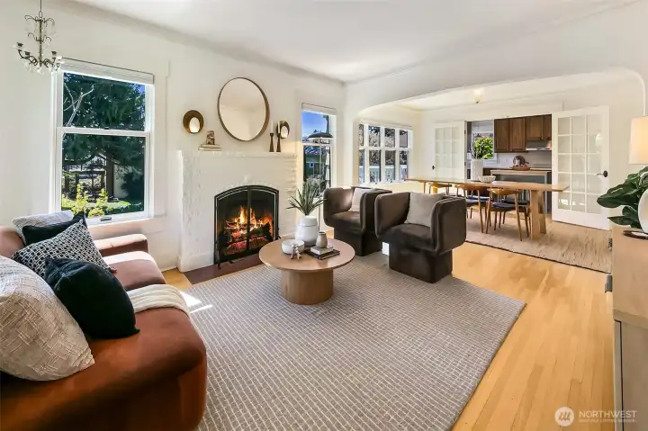 Enter from a charming covered front porch to a lovely living room and open floor plan.