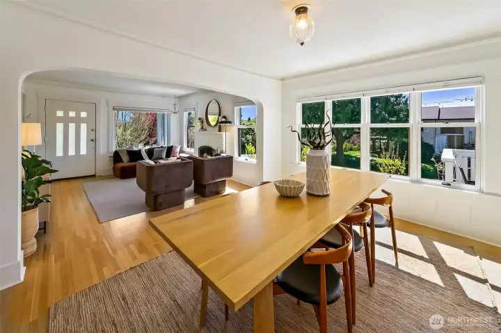 Beautiful refinished original hardwood floors flow through the grand space. Lit by great light and curated light fixtures.