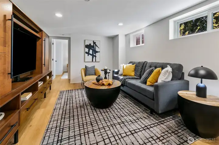 Welcome to the remodeled lower level. Great ceiling height and done right. Lots of storage and prime for a MIL (just add a kitchenette).