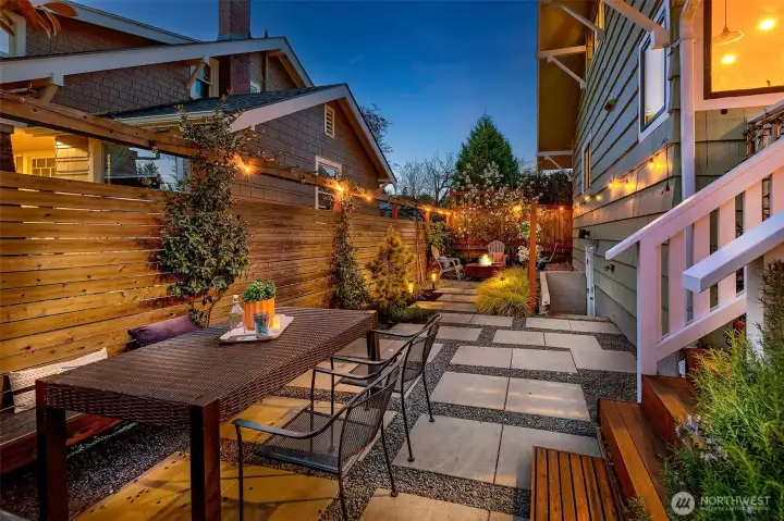 Perfectly sized yard complete with garden, patio, dining and fire pit.