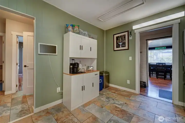 As you head to the right, you will find the wet bar and another bathroom.