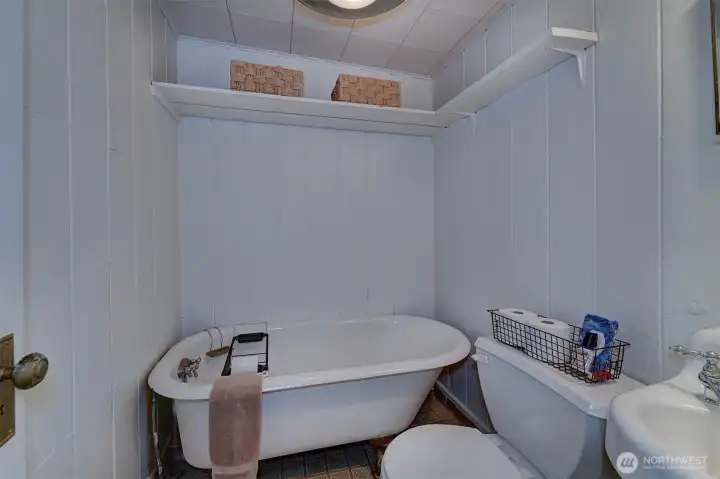 3/4 bath has a clawfoot tub - charm that fits the age of the home.