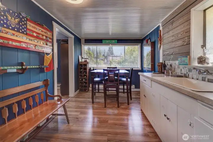Wet bar and dining space with windows that bring in lots of natural light.
