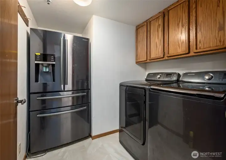 Laundry room with extra refrigerator!