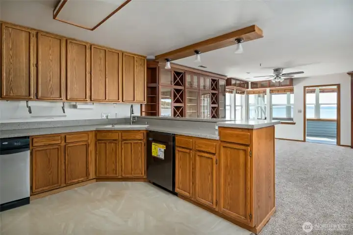 Kitchen looking towards dining area and sun room beyond