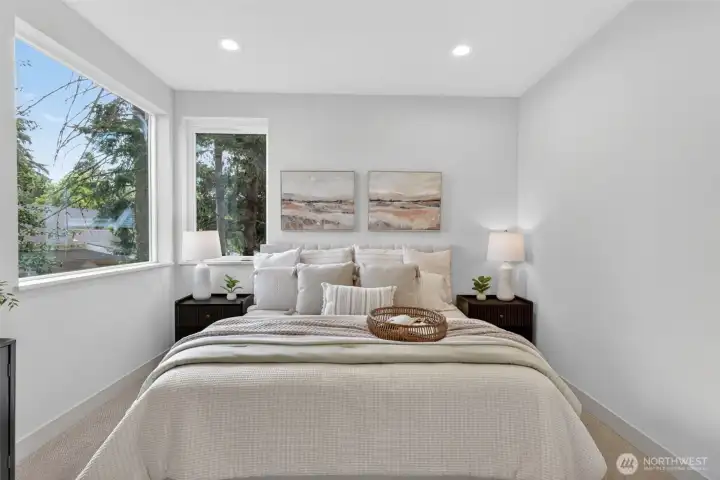 A deluxe primary suite featuring a walk-in closet and double vanity on one end, and two bedrooms/flex rooms plus a full bath on the other.