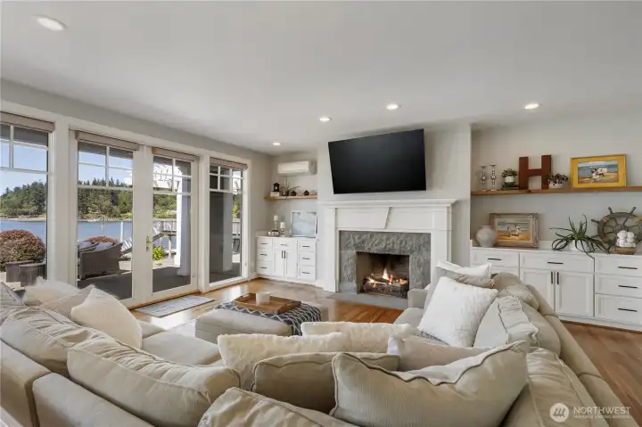 Custom cabinetry on either side of the gas fireplace.