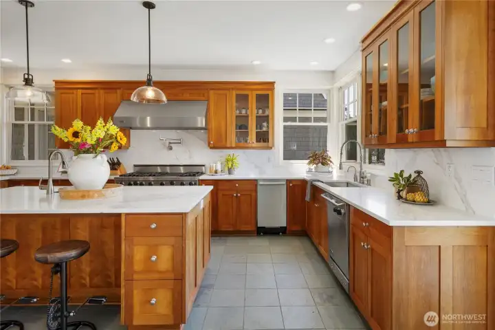 The gourmet kitchen is designed for gathering and culinary excellence, while multiple indoor and outdoor living areas provide seamless opportunities to relax, entertain, and embrace the waterfront lifestyle.