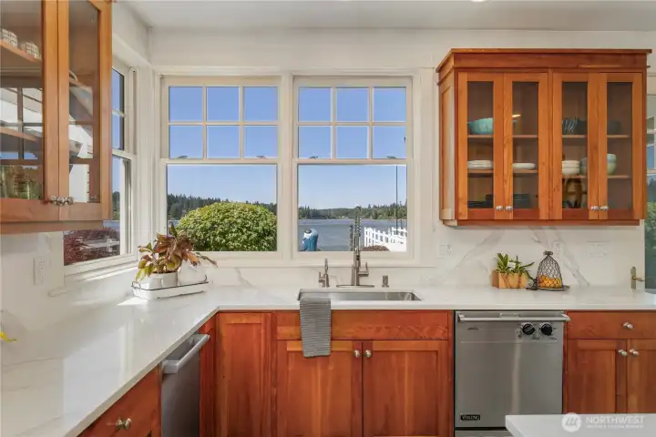 Quartz countertops paired with a matching backsplash for a seamless look.