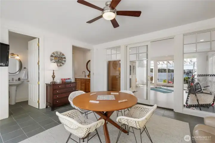 Expansive game room, fitness area, sauna, & steam shower.