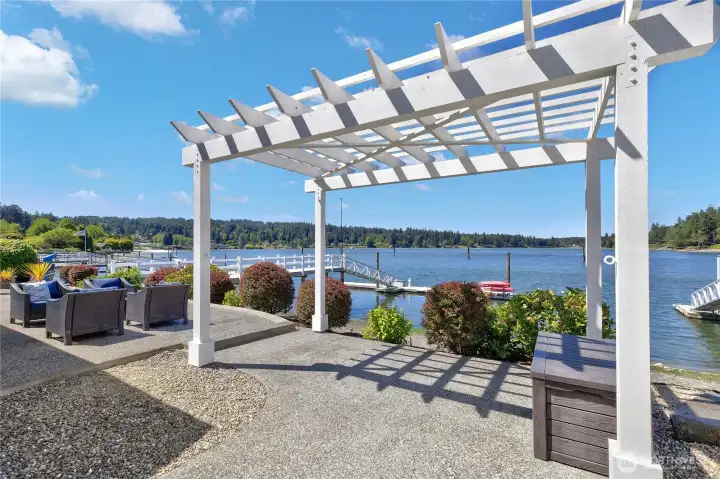 Unwind beneath the waterfront gazebo, or entertain on the expansive patio featuring a covered grilling area.