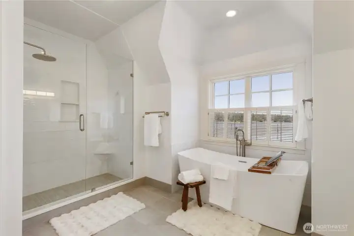 Beautifully renovated spa-inspired bath with freestanding soaking tub.