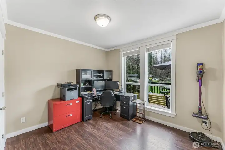 Bedroom #3 is currently used as an office and features landscaped yard views.