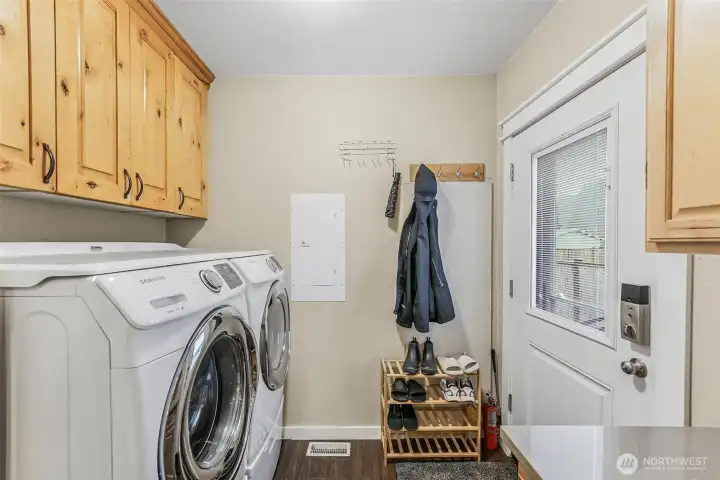 Laundry/mud room with washer and dryer that stay for your convenience.