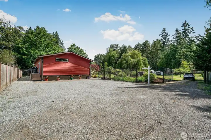 Plenty of parking at the end of the home. Front door is on the right and back door on the left side.