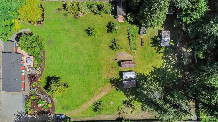Aerial view of the 1.4 acre lot and home.