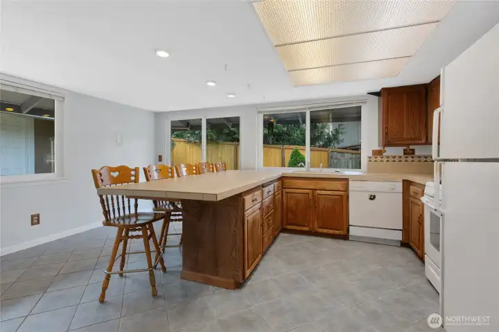 Larger kitchen with space for barstools and eating space!
