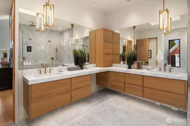 Sublime view primary suite with walk in closet, mini-kitchen and luxurious 5 piece bath enhanced with walk in 3-head rain shower, soaking tub, floor to ceiling bianco venitino marble slab walls. Moreover, the 5-panel accordion doors offer optimal view + lead to private outdoor deck.