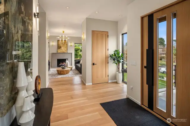 Upon arrival, the oversized, black steel pivot door sets the tone. 10 foot ceilings enhance the luxurious finishes, along with eight inch wide plank white oak floors and eight foot white oak doors.