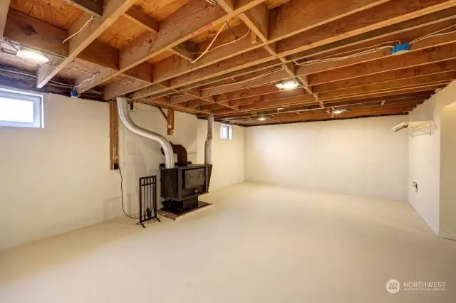 Daylight basement with bonus room and bathroom. The ducted woodstove adds supplemental heat to the entire home.
