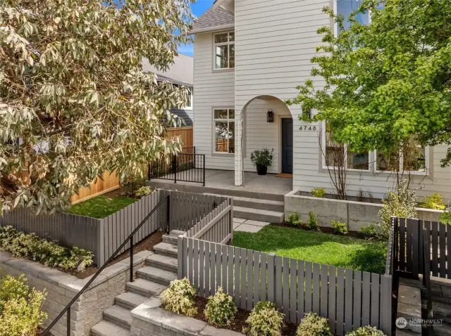 Fenced yard and elevated front porch greet you.