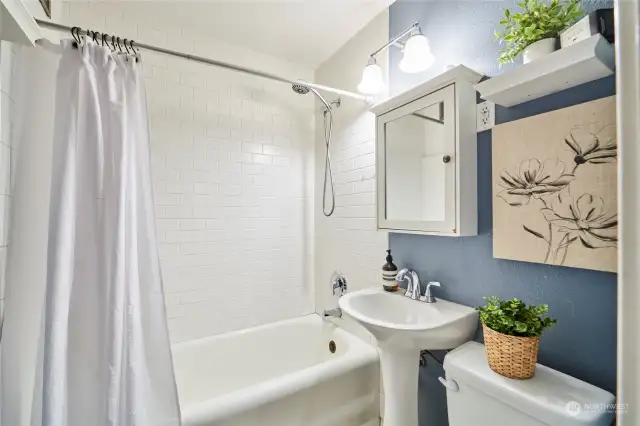 Charming bathroom with stylish updates and designer paint colors.