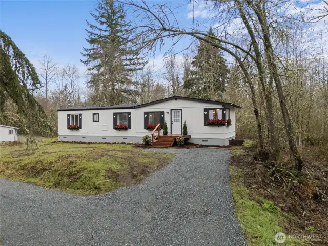 Perched on this 5 acres is this adorable updated home!