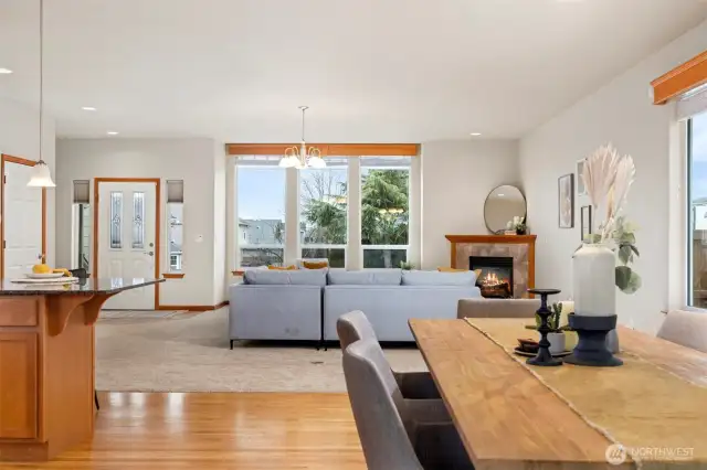 Looking from the dining room toward the front entry and the living room in between.