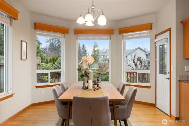 The dining room can accommodate at least 10-12 chairs easily.