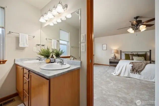 The primary bedroom is quite spacious and the full bath has a double sink vanity.