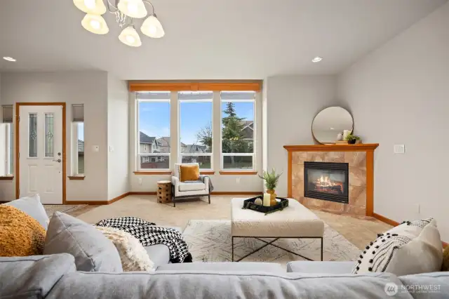 Welcome inside the home! There is a lovely living room with a gas fireplace and a large picture window that looks to the north and the Canadian Mountains.
