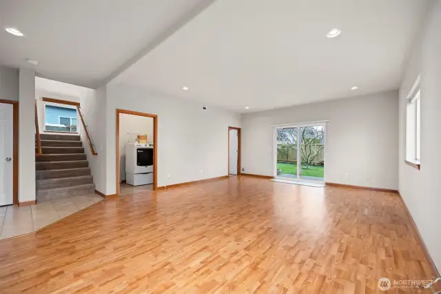 The lower family has laminate flooring and is very large and can accommodate a pool table and a large sectional as well as a big screen television.