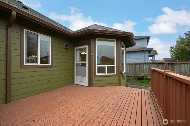 The deck off the dining room and kitchen is the perfect size for grilling, eating and taking in the sunsets.