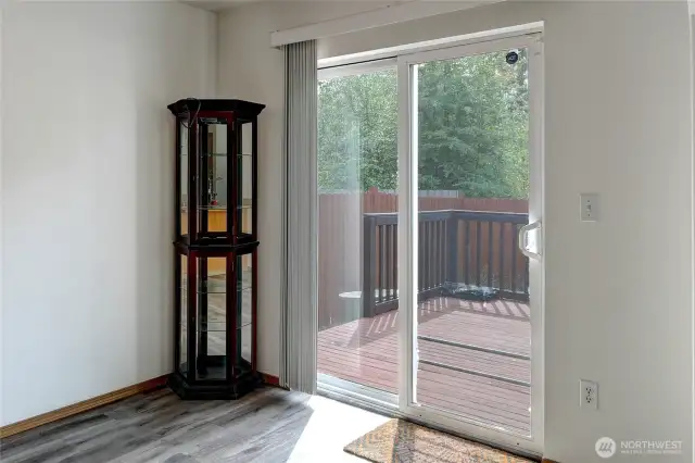 Sliding doors from dining room lead to deck
