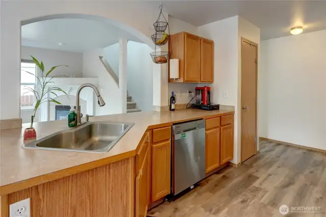 Nice curved wall in kitchen opens the space up to the living room area keeping the cook part of the activities.