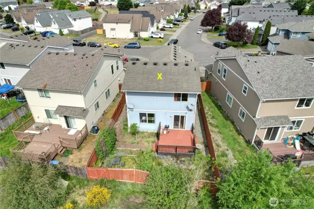 Aerial view of the fenced back yard