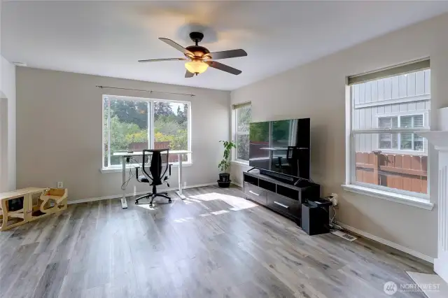 The updated LVP flooring covers the main level of the home