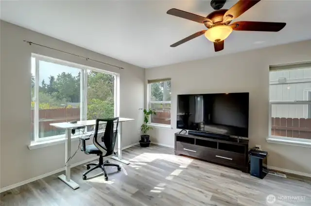 Bright windows throughout the home. Here the temporary desk set up overlooks the back yard.