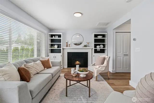 Bookshelves frame the gas fireplace