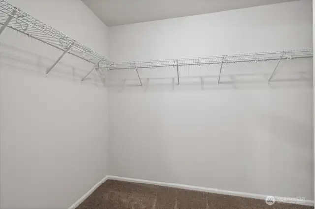 Primary WIC-Interior Pictures: Disclaimer- Photos are of another Lina floor plan from a previous community, photos are for illustrative purposes only. Finishes, flooring, upgrades, or other features may vary.