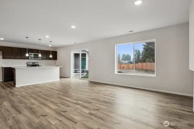 Open concept living/dining/kitchen-Discalimer-Disclaimer- Photos are of another Lina floor plan from a previous community, photos are for illustrative purposes only. Finishes, flooring, upgrades, or other features may vary.