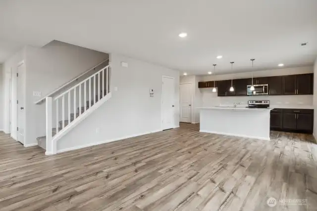 Open concept living/dining/kitchen-Discalimer-Disclaimer- Photos are of another Lina floor plan from a previous community, photos are for illustrative purposes only. Finishes, flooring, upgrades, or other features may vary.
