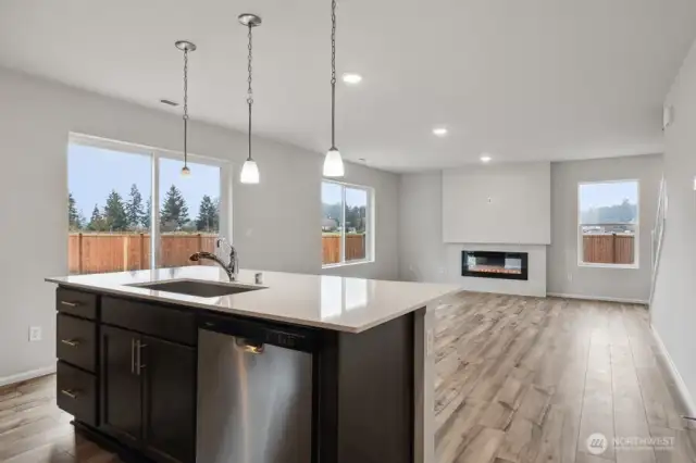 Open concept living/dining/kitchen-Discalimer-Disclaimer- Photos are of another Lina floor plan from a previous community, photos are for illustrative purposes only. Finishes, flooring, upgrades, or other features may vary.