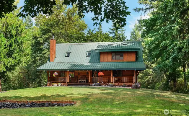 This impressive log home showcases the natural beauty of the region, featuring large, handcrafted logs.
