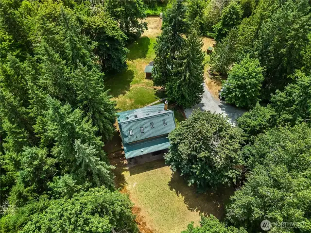 This three-story log home is an ideal choice for those seeking a rustic yet comfortable lifestyle, embracing the charm of a bygone era while enjoying the conveniences of modern living.